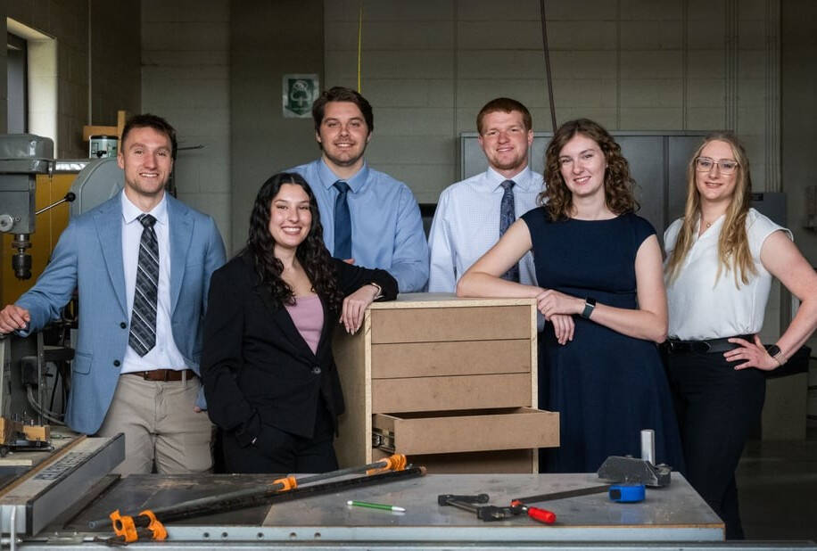 student team gathered around project